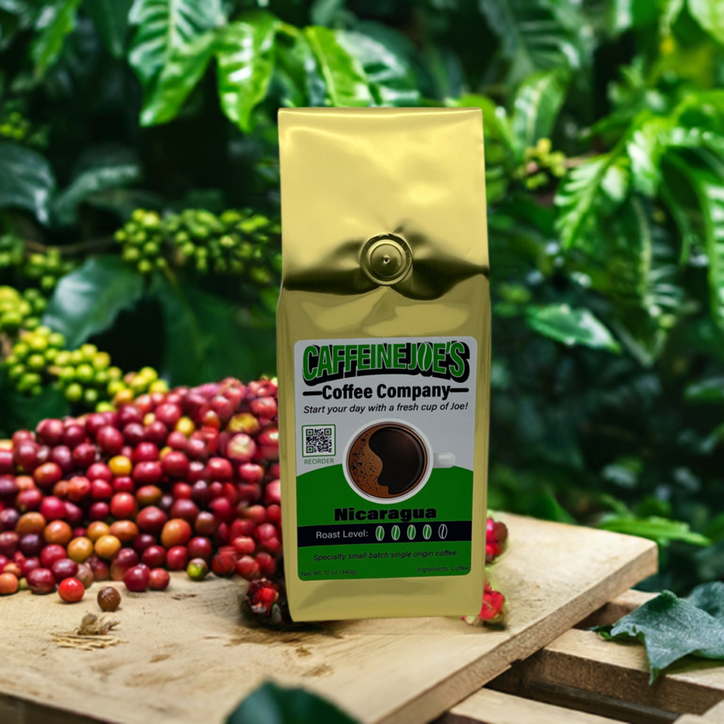 Bag of Nicaragua coffee from Caffeine Joe's Coffee Company with a label featuring coffee beans and lush tropical scenery.
